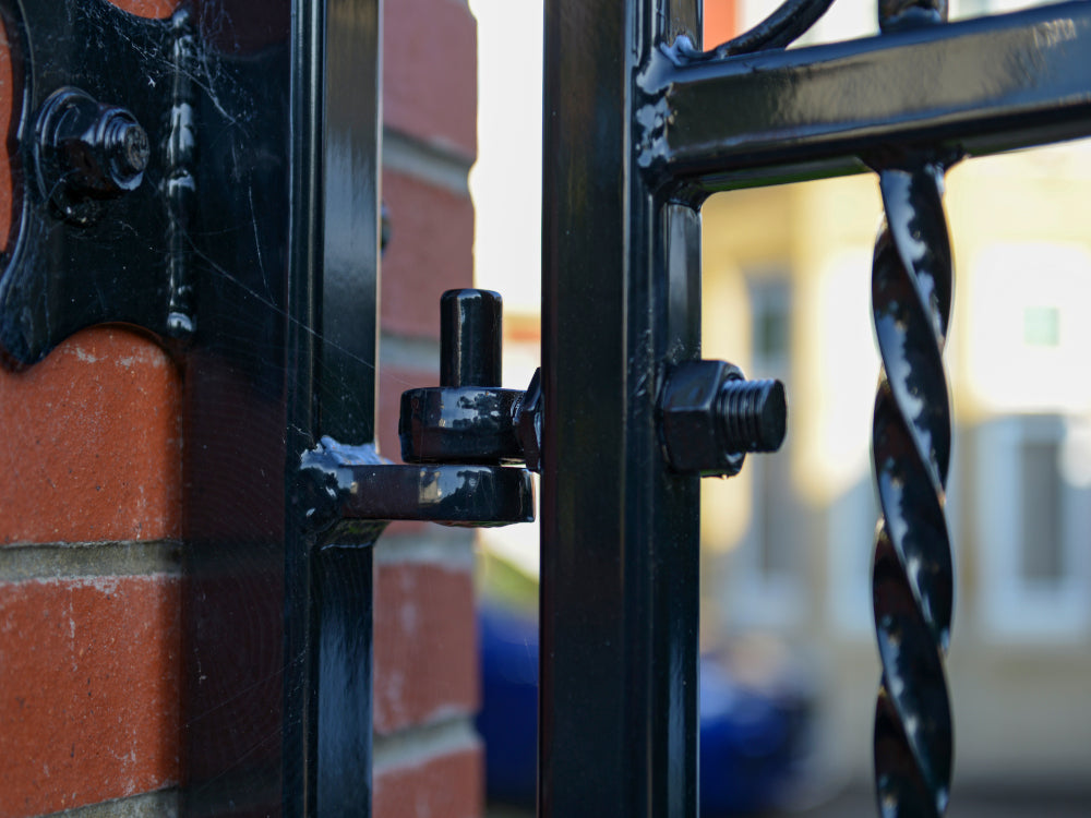 Metal Gate Hinge in Brick Wall