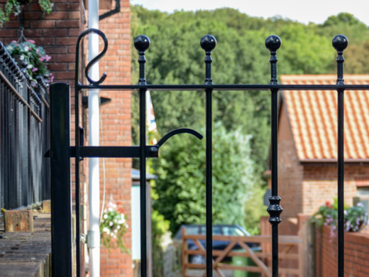 Black Metal Garden Gate Latch surrounded by private gardens